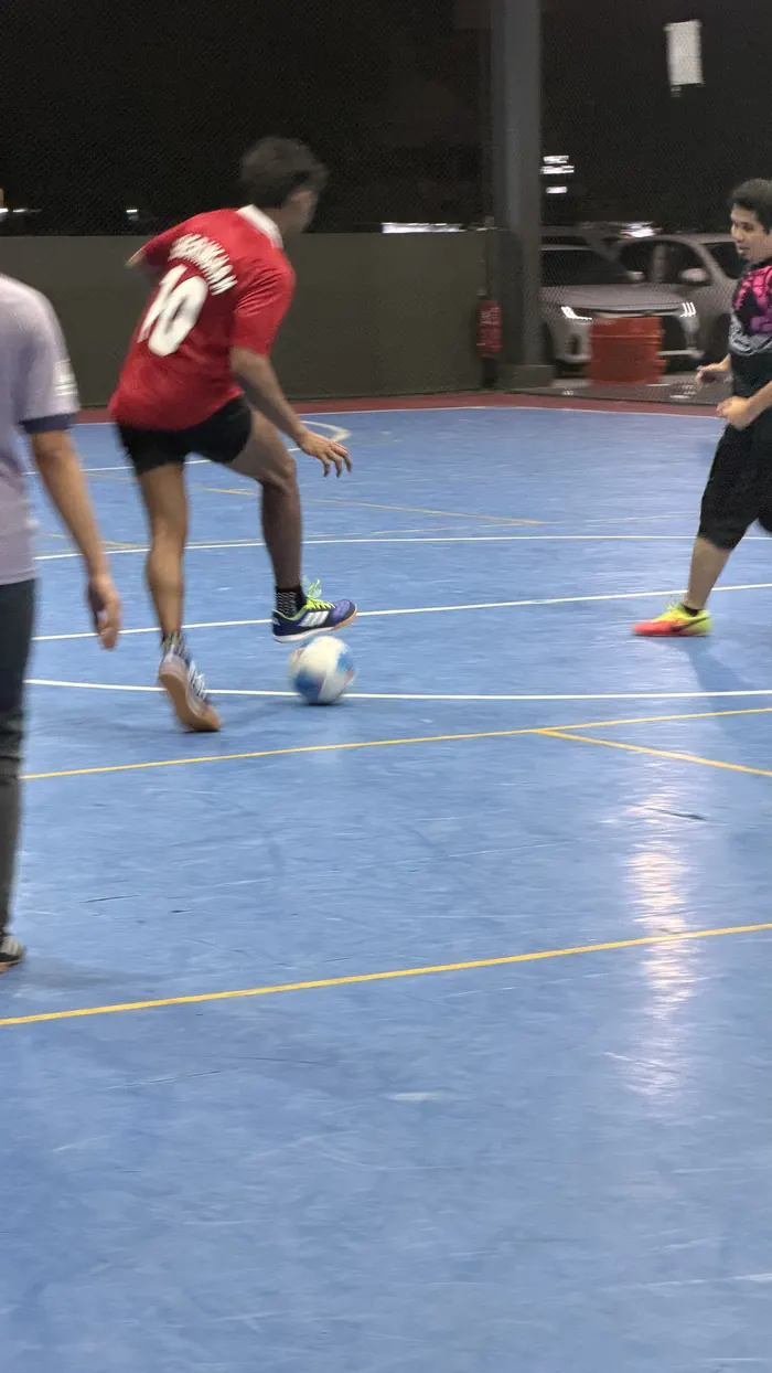Players warming up on the futsal court